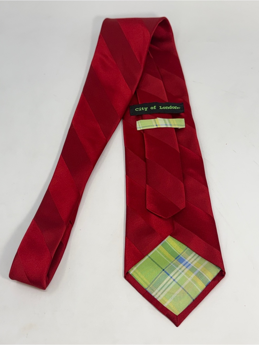 City of London 
red diagonal striped tie with green plaid lining